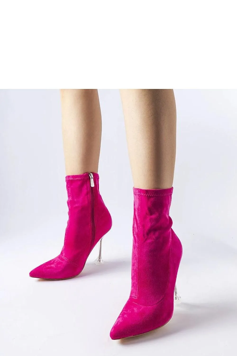 Green ankle boots on a decorative heel