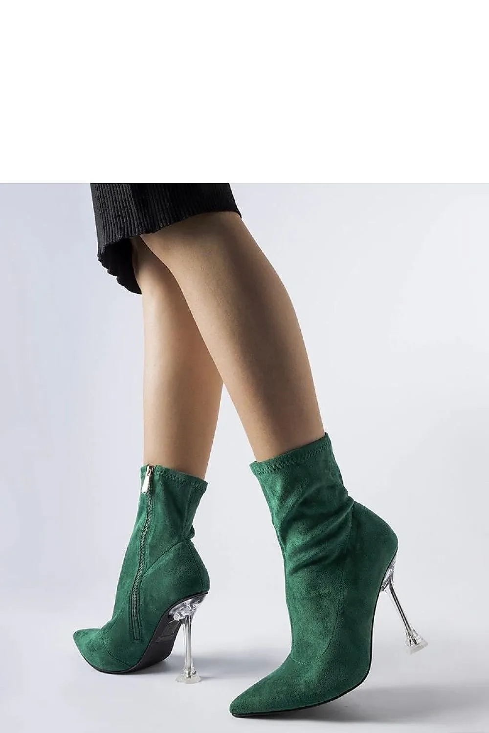Green ankle boots on a decorative heel