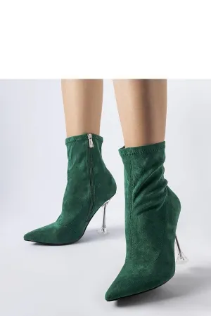 Green ankle boots on a decorative heel