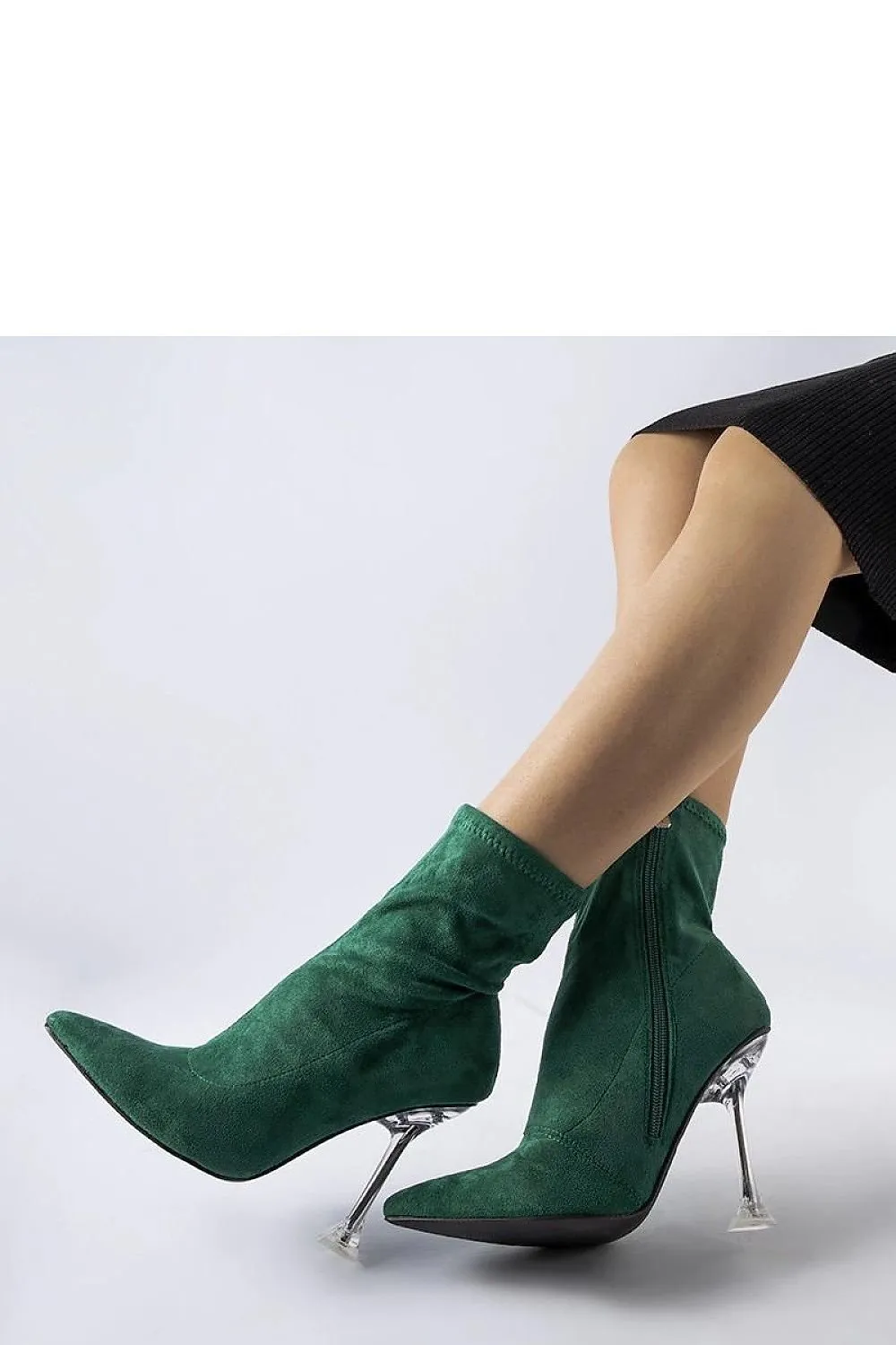 Green ankle boots on a decorative heel