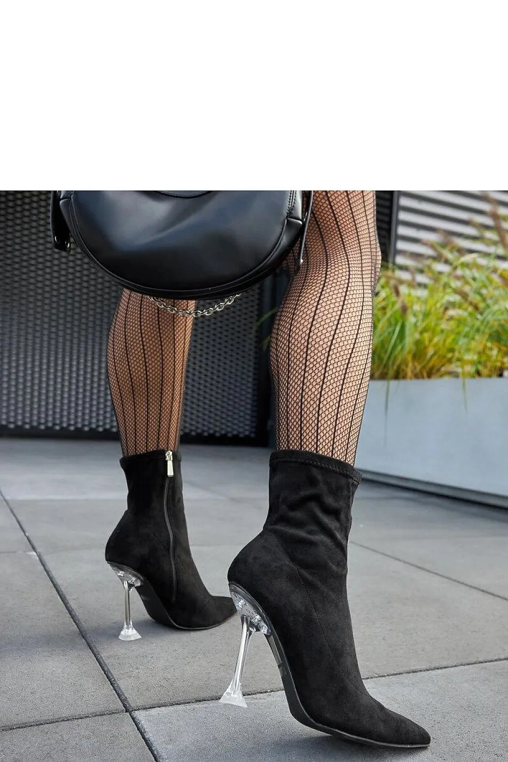 Green ankle boots on a decorative heel
