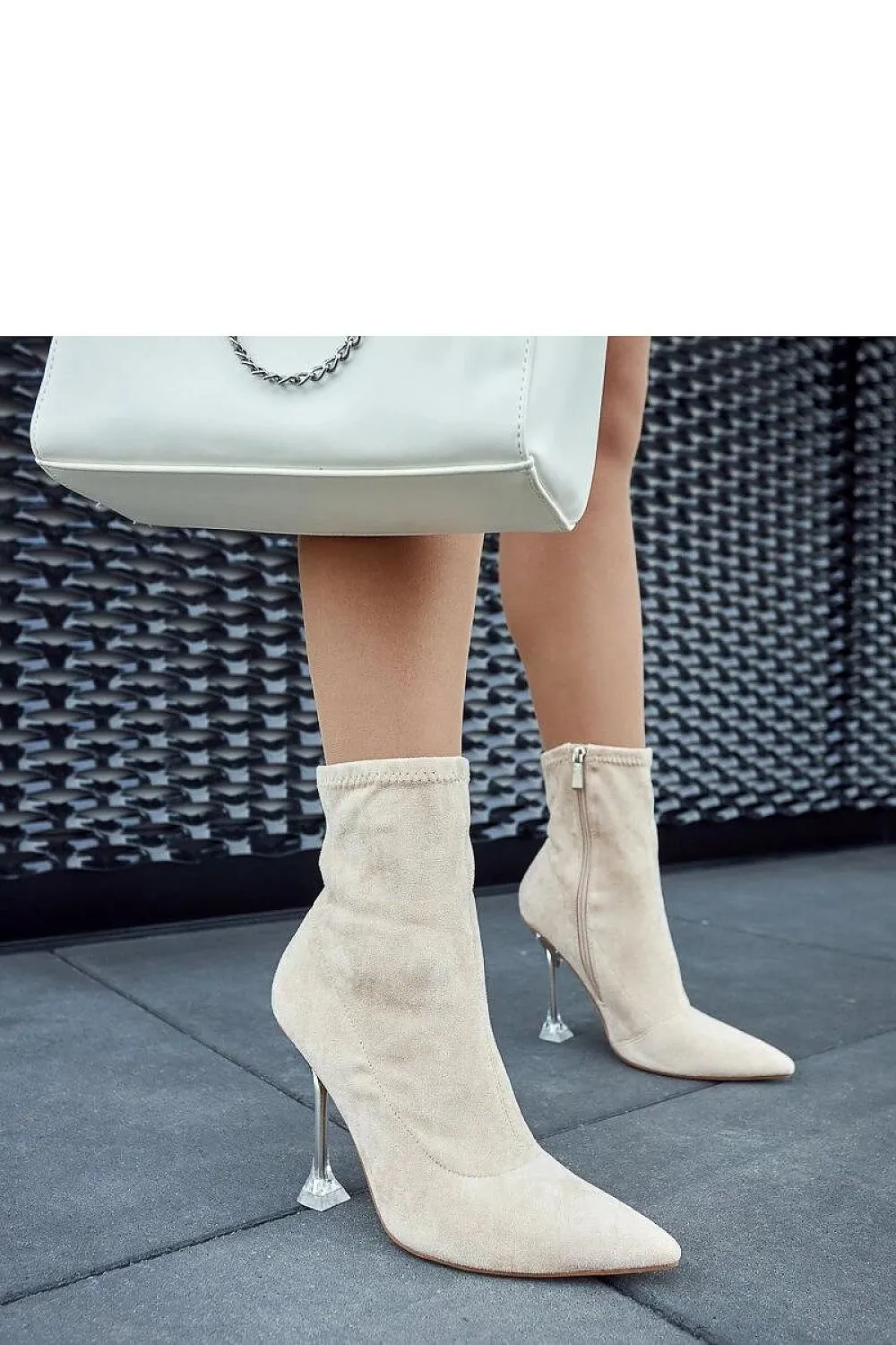Green ankle boots on a decorative heel