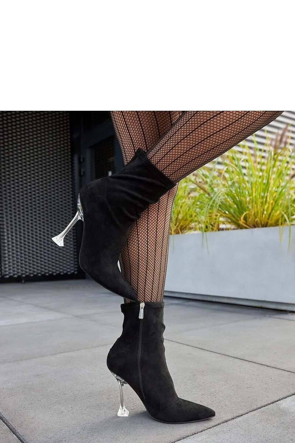 Green ankle boots on a decorative heel