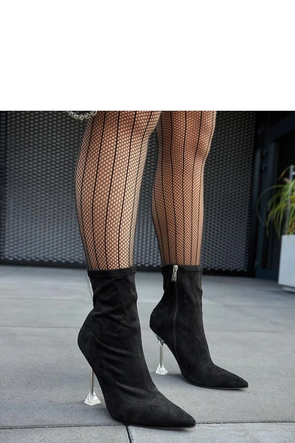 Green ankle boots on a decorative heel